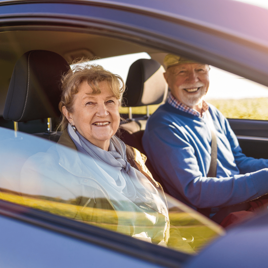 senior couple driving well maintained vehicle